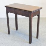 A George III mahogany fold-over tea table,