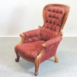 A Victorian red upholstered show frame button back armchair