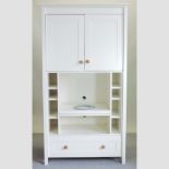 A white painted two door cabinet, fitted with open shelves,