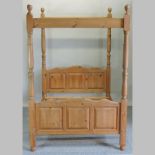 A pine four poster double bed,