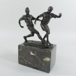A bronze figure group of two footballers,
