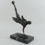 A bronze figure of a footballer, on a marble base,