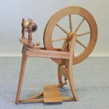 A wooden spinning wheel,