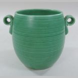 A 1940's green glazed vase, in the style of Keith Murray for Wedgwood,