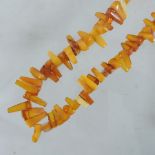 WITHDRAWN An amber single strand necklace,