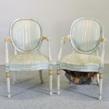 A pair of cream painted show frame upholstered armchairs