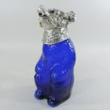 A blue glass and plated novelty claret jug, in the form of a bear,