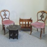 A pair of Victorian carved walnut dining chairs, with pink upholstered seats,