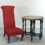 A Victorian red upholstered prie dieu, together with a carved oak gateleg table,