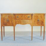 A reproduction serpentine sideboard,