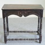 An 18th century carved oak side table, inscribed '1671',