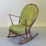 An Ercol dark elm rocking chair,