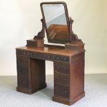 A Victorian mahogany pedestal dressing table, on a plinth base,
