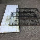 A pair of black painted wrought iron garden gates, each 132 x 110cm,