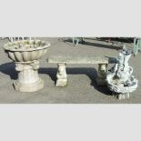 A reconstituted stone garden bench, 110cm, together with a fibreglass garden ornament,