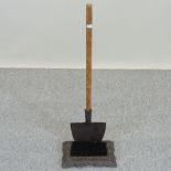 A long handled boot scraper and brush,