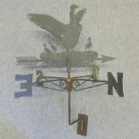 A black painted metal cockerel weather vane, in the form of ducks,