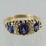 An 18 carat gold sapphire three stone ring,