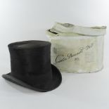 A top hat, by West & Co, London,