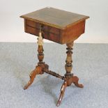 A Victorian walnut and crossbanded ladies work table, on a splayed base,