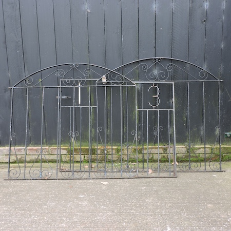 A pair of black painted metal gates,