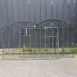 A pair of black painted metal gates,