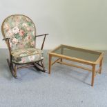 An Ercol dark elm rocking chair, with floral upholstered cushions,