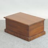 A walnut box, with a hinged lid,