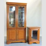 A modern cherry wood glazed display cabinet, 96cm, bookcase together with a matching cabinet,