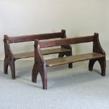 A pair of Victorian stained pine pews,