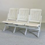 A white painted folding tennis bench,