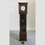 A mid 20th century oak cased granddaughter clock,