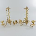 A pair of late 19th century gilt metal three branch chandeliers,