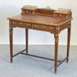 A late 19th century French walnut and gilt metal mounted writing desk, on square tapered legs,