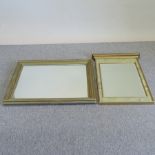 A marble effect wall mirror, 92 x 55cm overall,