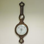 A 19th century rosewood cased wheel barometer, with a spirit level below,