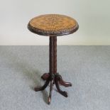 A 19th century parquetry occasional table, on a fluted column and splayed base,