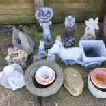 A collection of garden ornaments, to include planters,