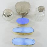 A set of early 20th century guilloche enamel and silver backed dressing brushes,