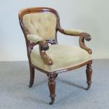 A Victorian carved walnut and cream upholstered open armchair