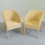 A set of four wicker conservatory chairs