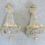 A pair of gilt metal mounted glass chandeliers,