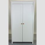 A white painted two door cabinet,