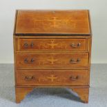 An Edwardian mahogany and inlaid bureau,