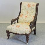 A Victorian show frame cream floral upholstered nursing chair
