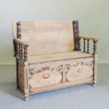 A 1920's oak monk's bench,