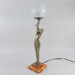 An Art Deco style figural table lamp, with a glass shade,