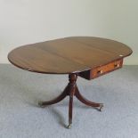 A Regency style mahogany and strung sofa table, on a splayed base,