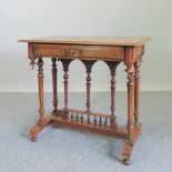 A 19th century pitch pine side table, with a single drawer, on turned legs,