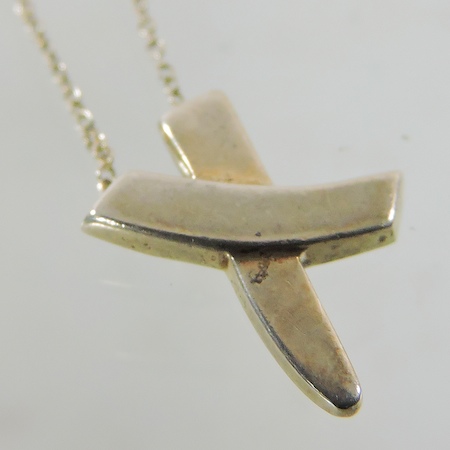 A Tiffany silver pendant on chain,